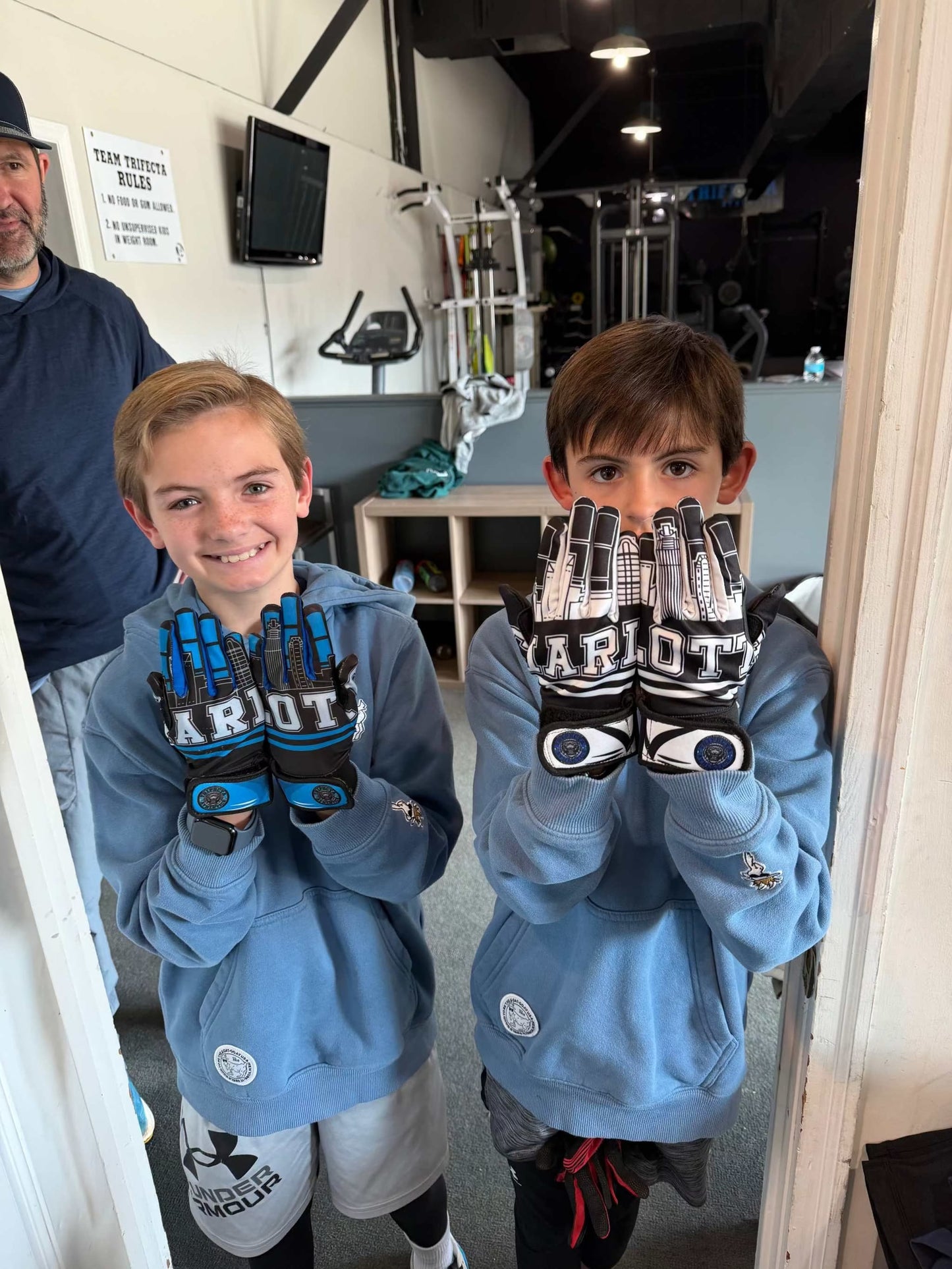 Charlotte skyline showcasing Carolina Batties Custom Prints gloves with leather front and sublimation back