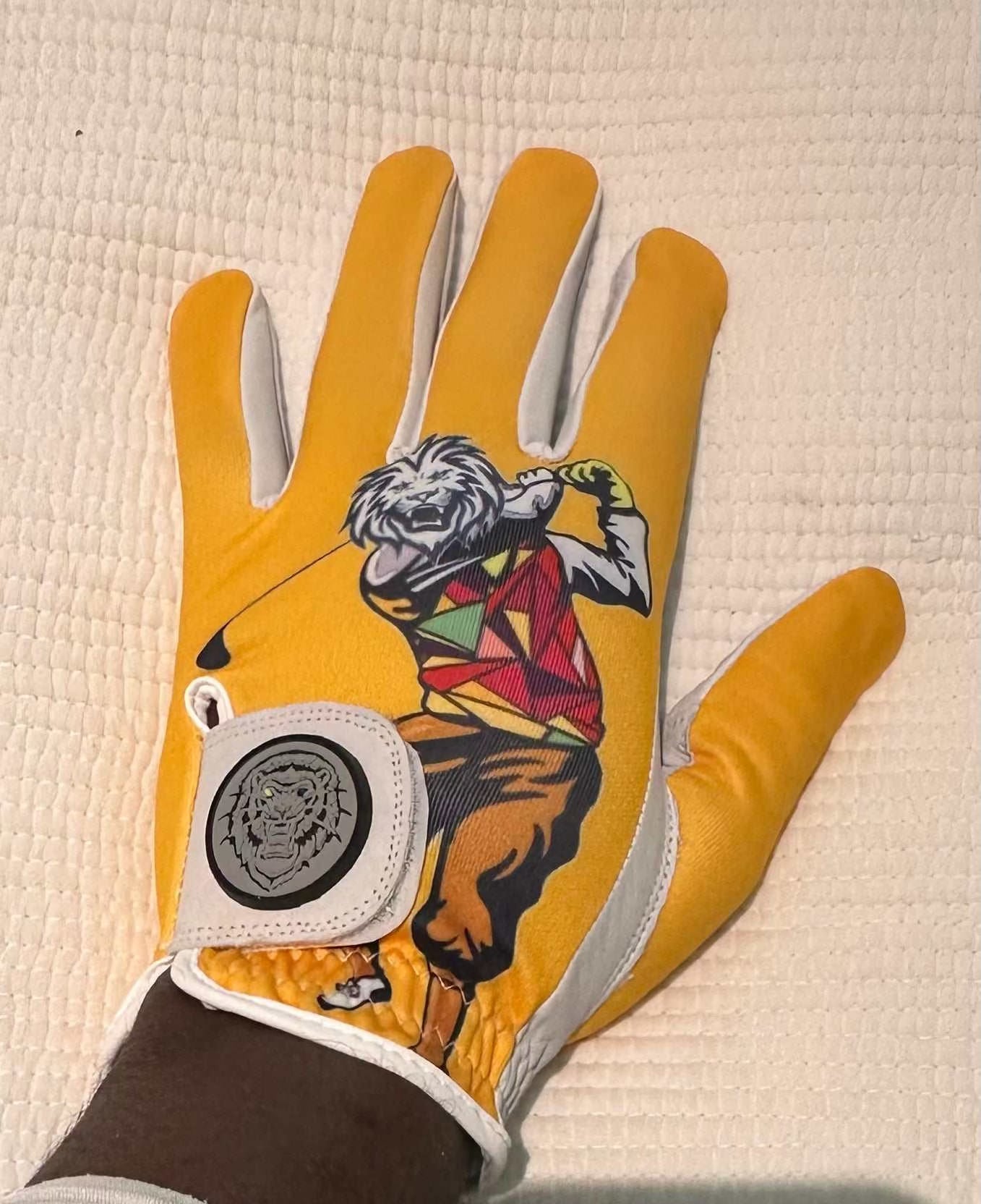 Black Lion Golfer glove with leather front, sublimation back, and elastic strap for flexible, breathable, and secure fit.