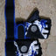 Blue and black weightlifting gloves with wrist wraps and padded palms for grip and protection