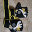black and yellow weightlifting gloves with wrist support and padded grip for gym workouts